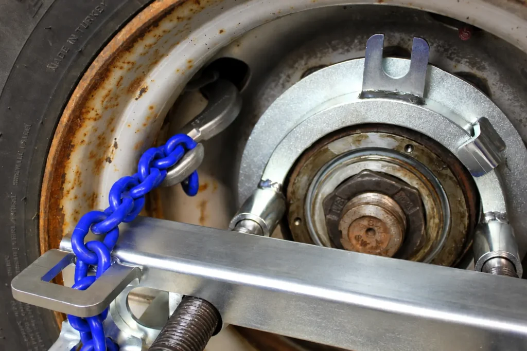 Rusty Wheel Hub and Blue Chain Fixture